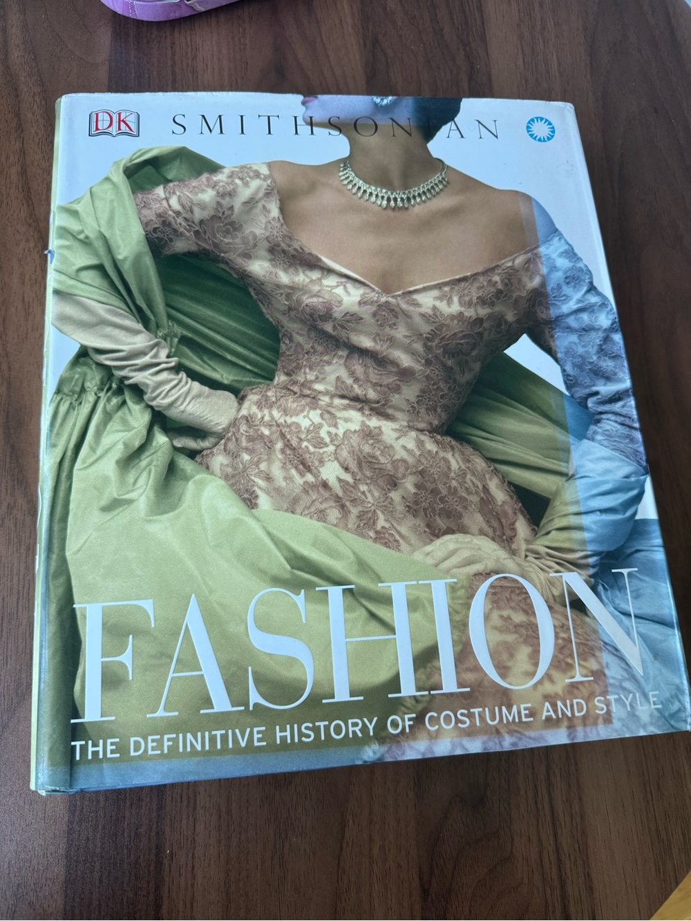 DK Smithsonian Fashion Hardcover Book - Green Cover with Cream Lace Dress